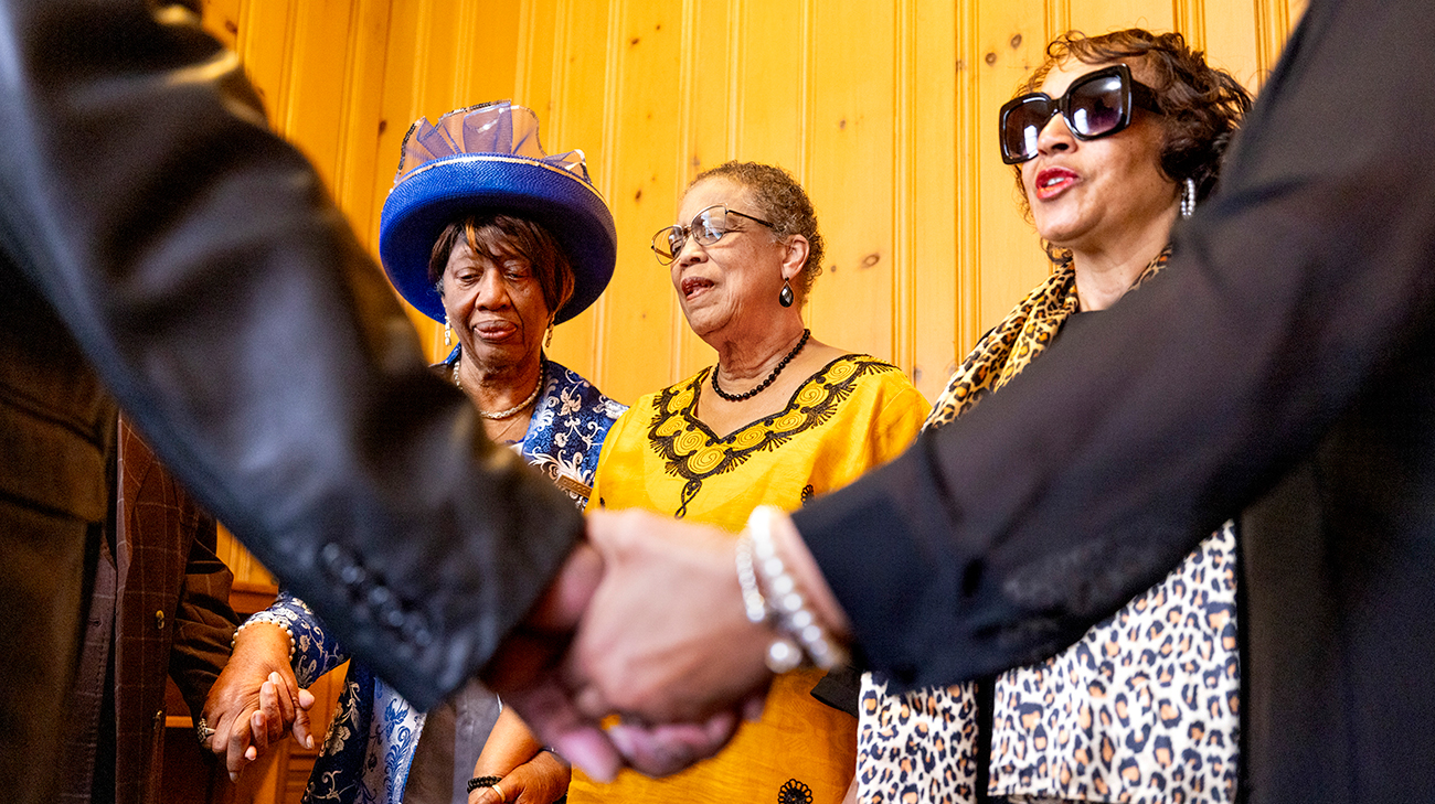 Charlene and others praying at church.