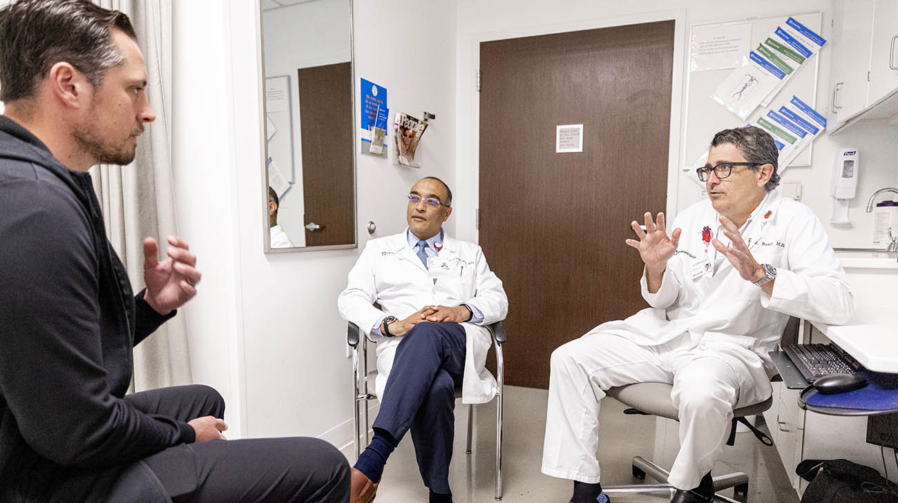 Zac with Drs. Milind Desai and Eric Roselli at Cleveland Clinic. 