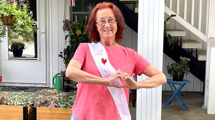 Mary wearing a sash to mark the 30th anniversary of her heart-transplant procedure.