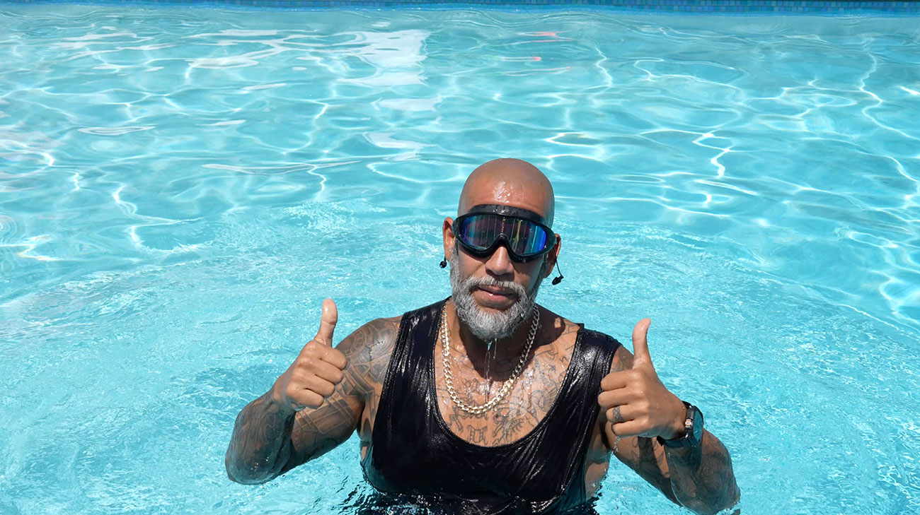 Patient, Edwin Oquendo, swimming in the pool for exercise.