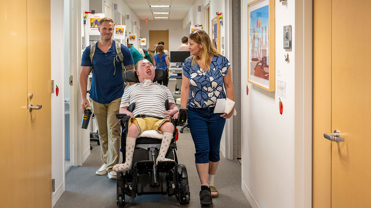 Alex, his brother Colbee, and mom Dawn, arrive for an appointment at the Pediatric Center for Airway, Voice and Swallowing Disorders (PCAVS).