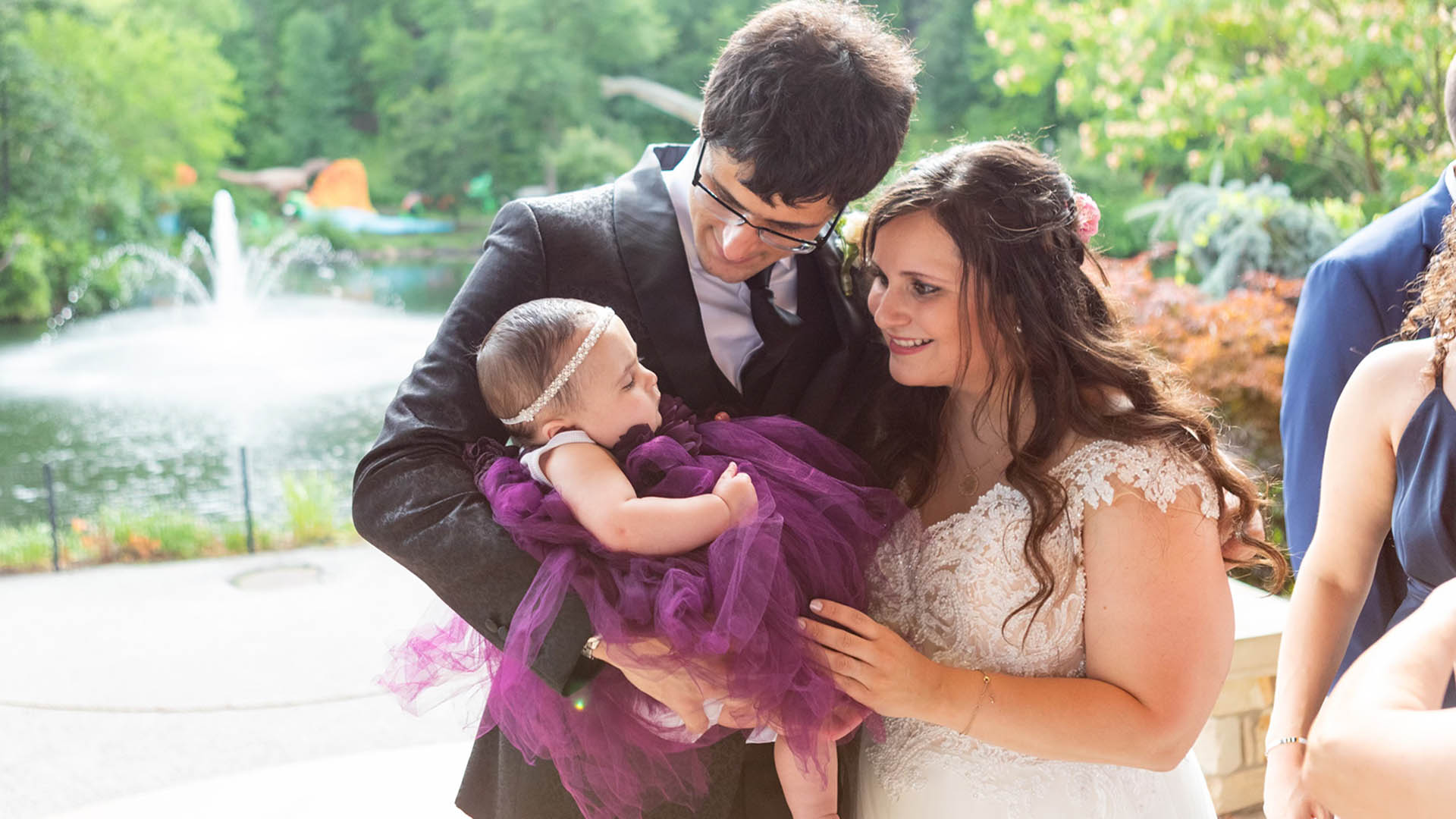 Evie, Tiffany and Alexander at a wedding. 