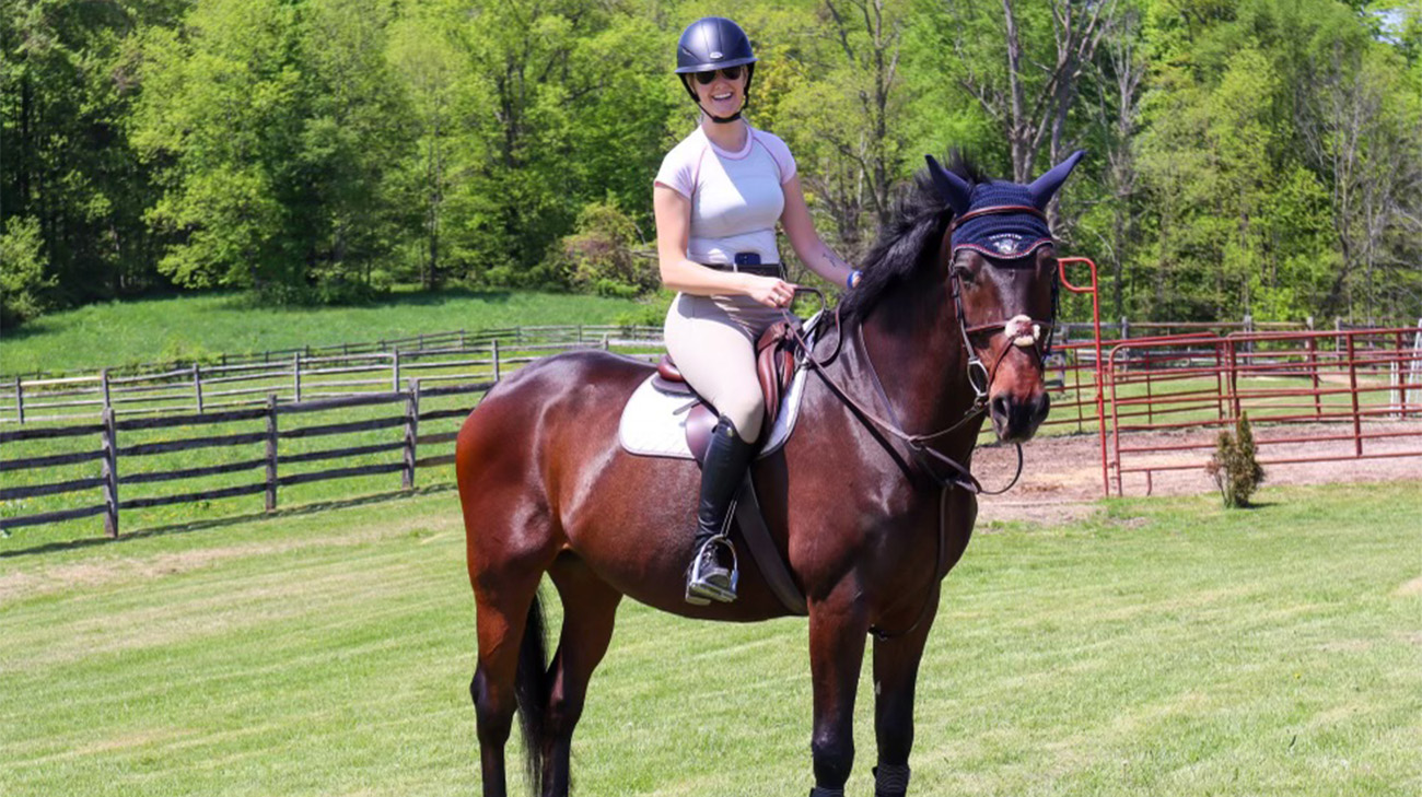 Molly riding a horse.