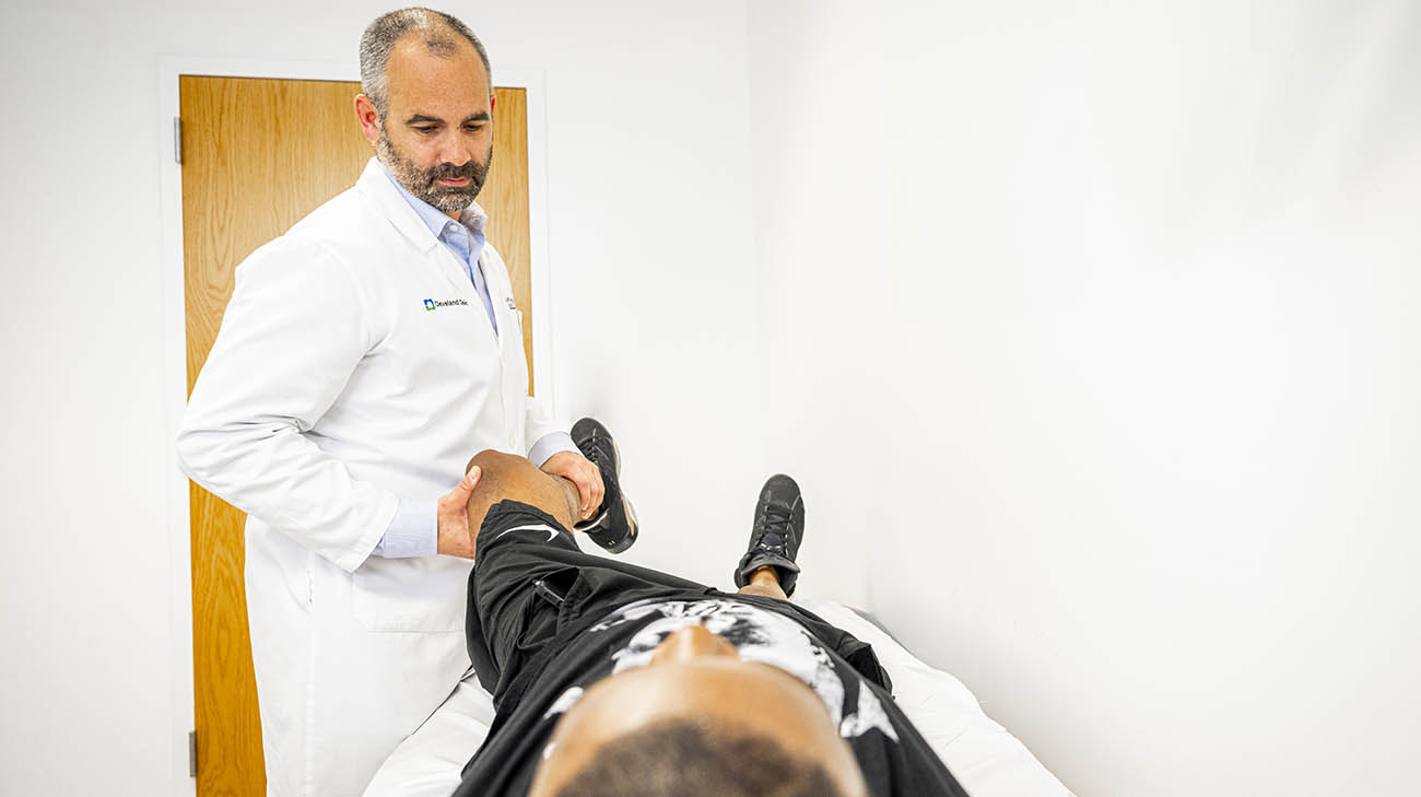 Rayshaun during a follow-up appointment with Dr. Nathan Mesko at Cleveland Clinic. 