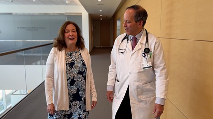 Susan walking with David Baran, MD