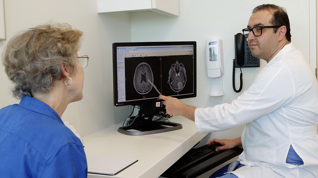 Dr. Razavi showing Dorothy her MRI