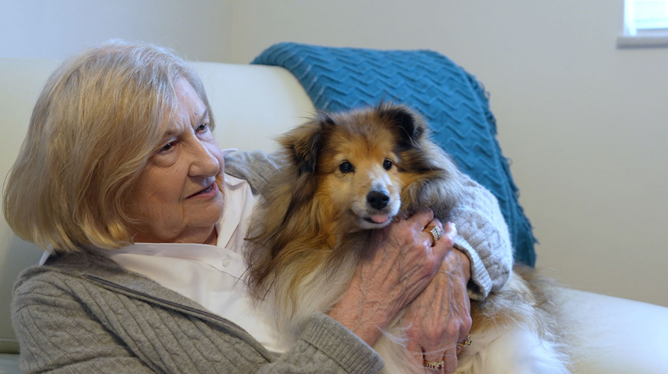 Diane Fiedler cuddling her pet dog.