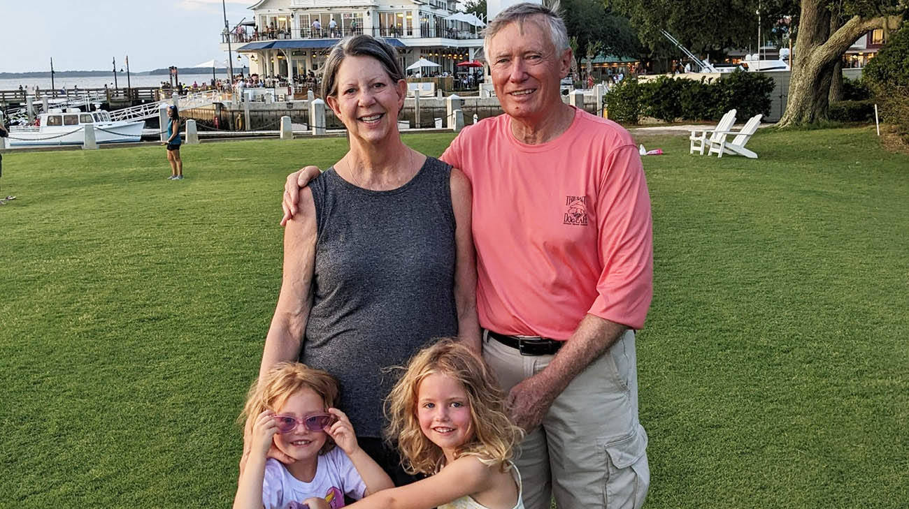 Laura with her husband and grandkids. 