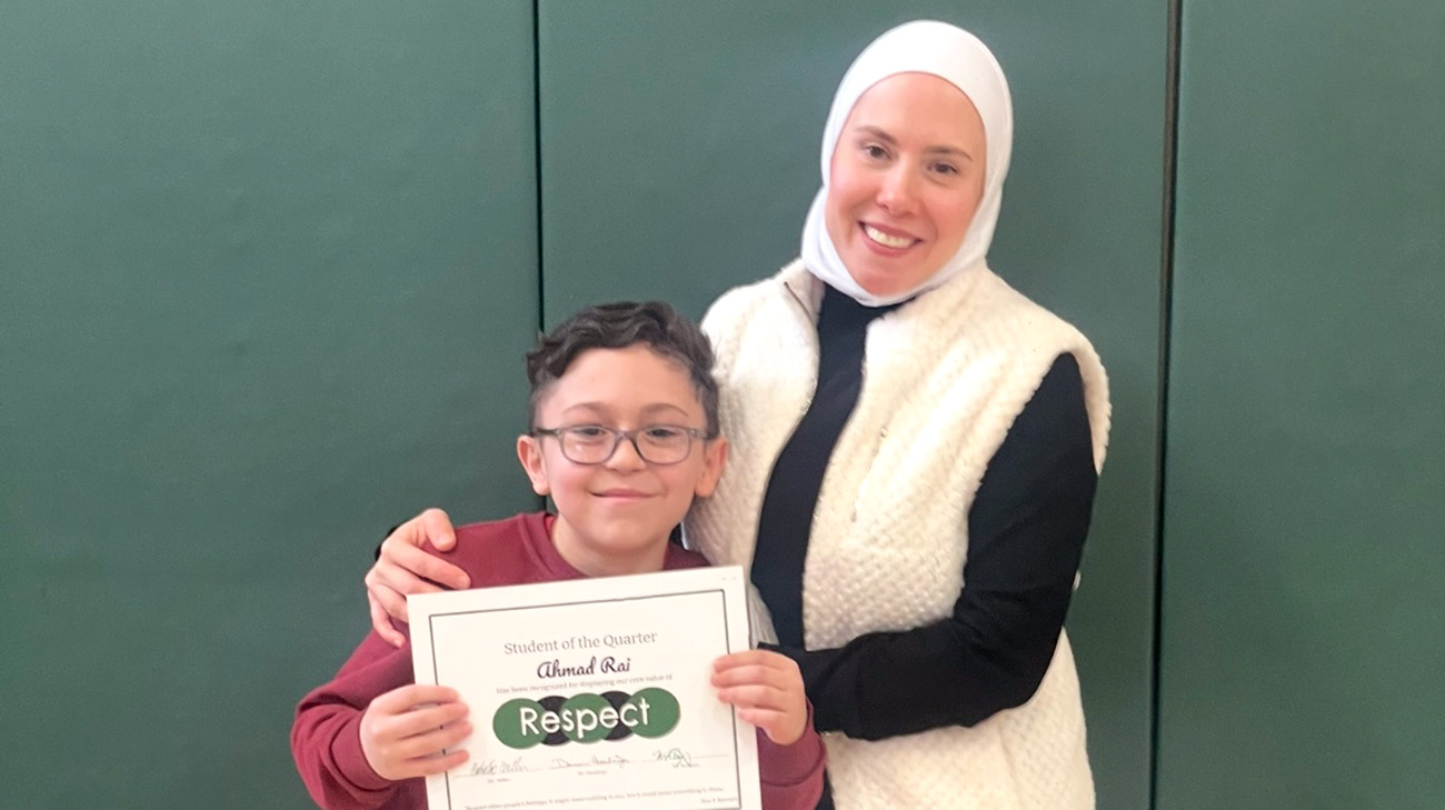 Ahmad with mom after getting an award at school