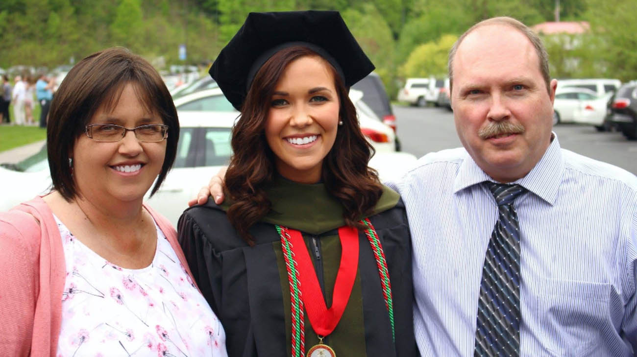 Jennifer and her husband, John, at their daughter's graduation from pharmacy school. Jennifer was in the midst of cancer treatment.