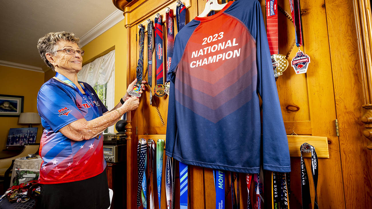 Luise showcasing her medals throughout the years.