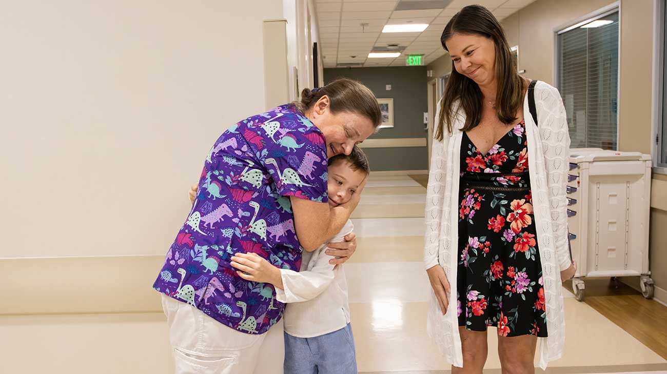 Nathan hugging Cheryl Sheppard, RN