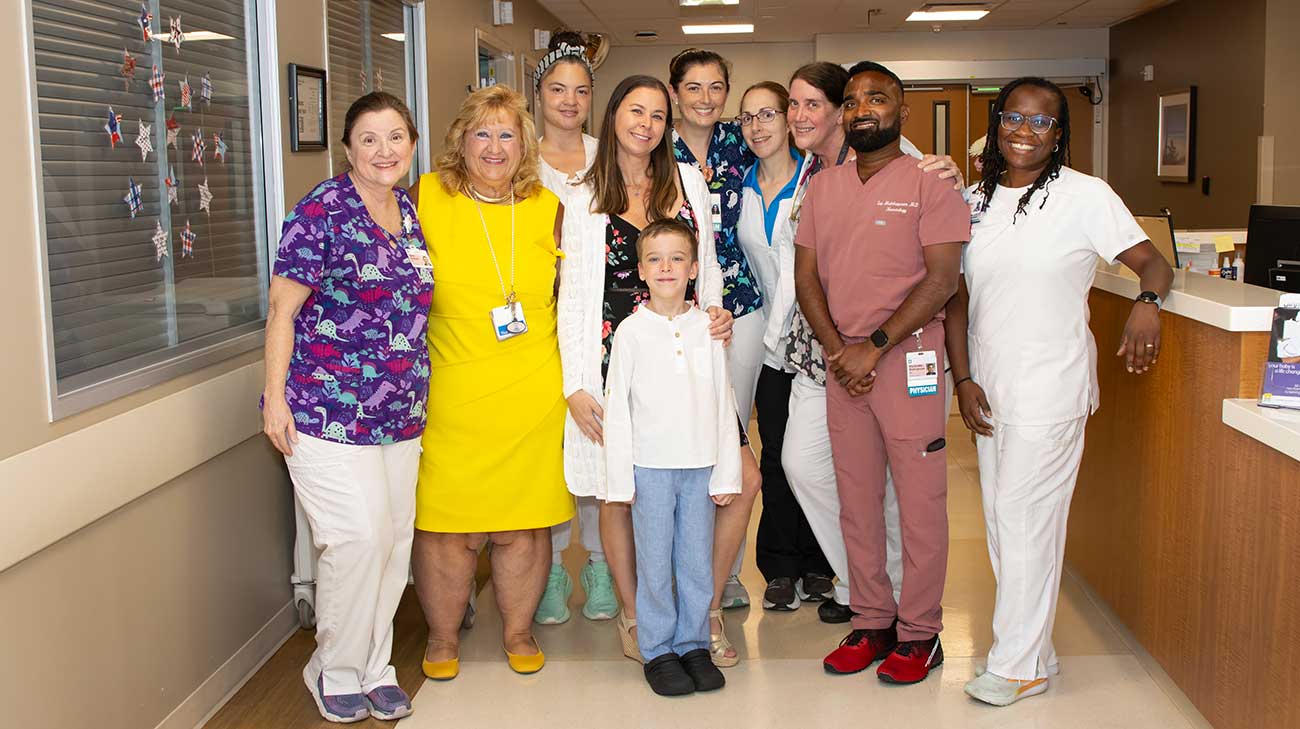 Nathan and his mom with Nathan's NICU care team.