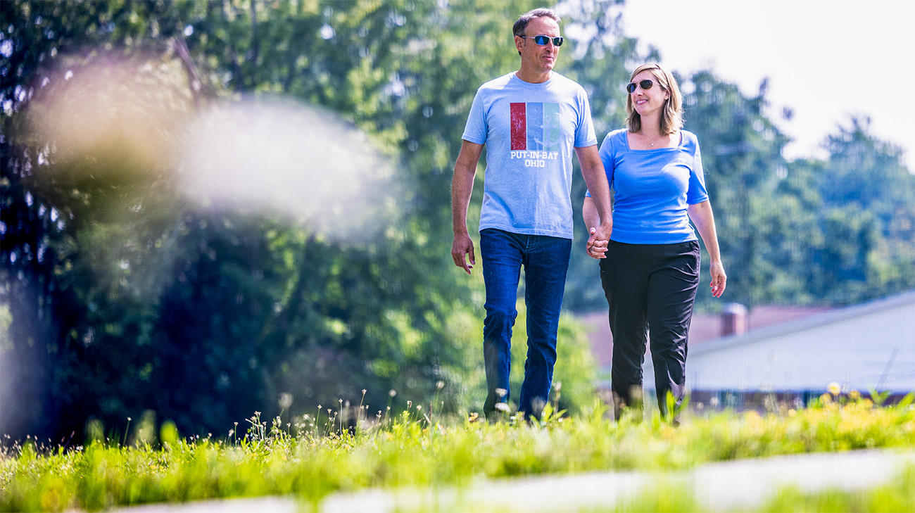 Sean and Lisa holding hands