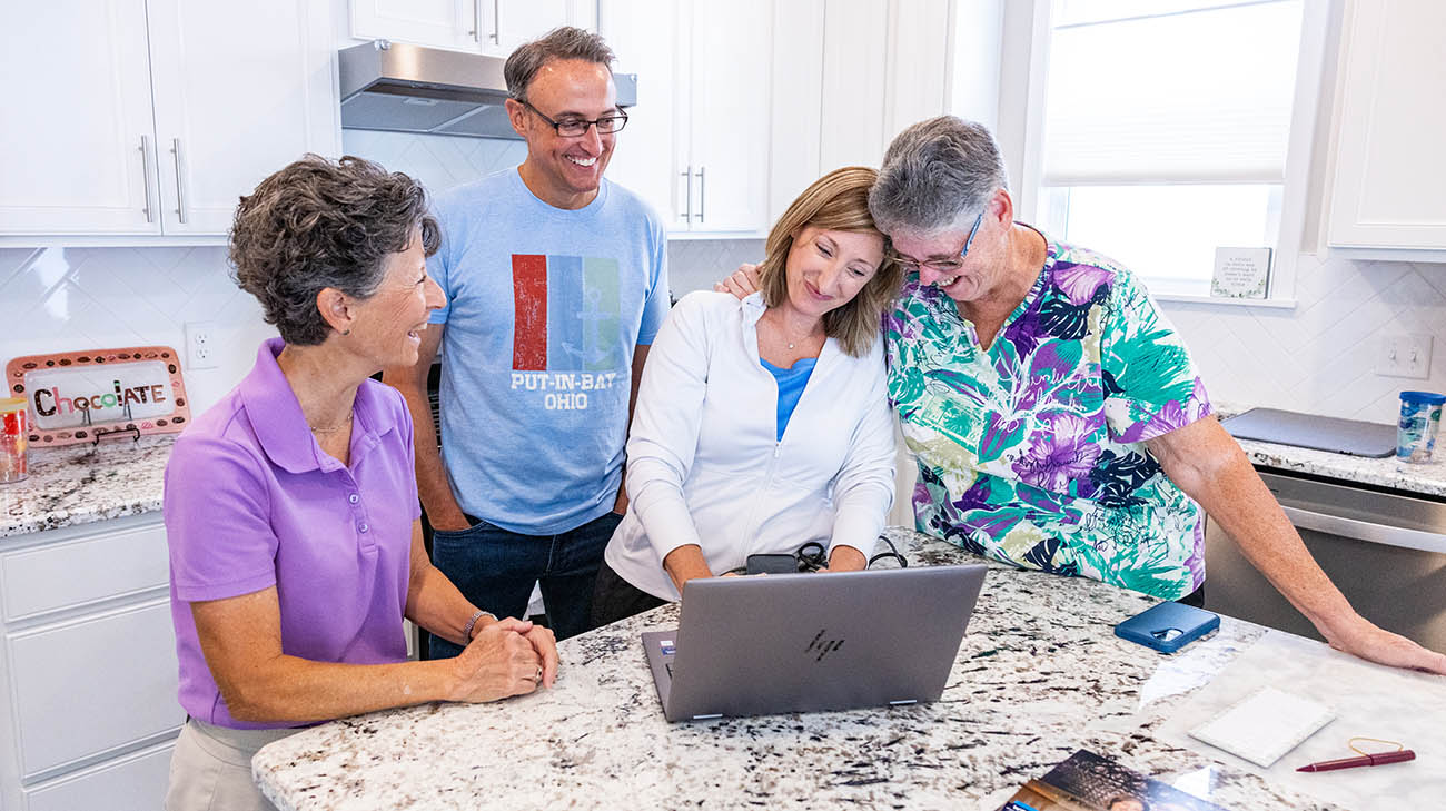 Sean, Lisa and two friends who are part of their support system discuss the calendar.