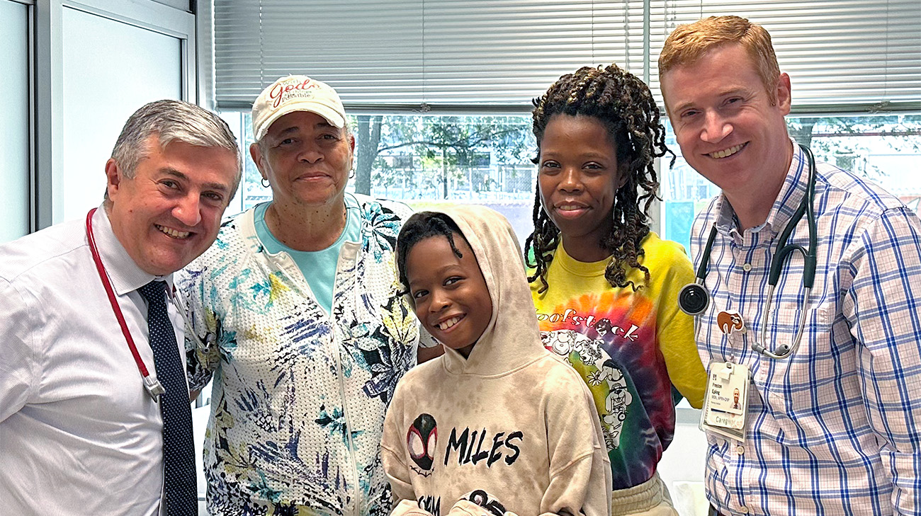 Annyanna with family and care team