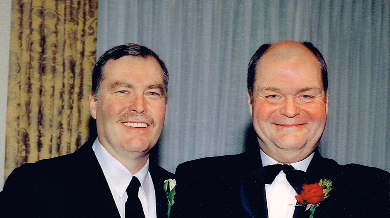 Bill (left) and brother John Grimberg (right) celebrating the wedding of Bill’s son. (Courtesy: Judith Allen)