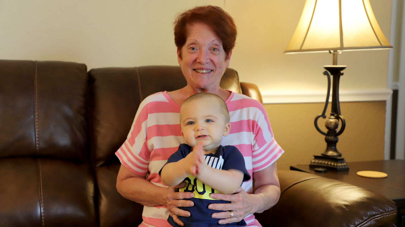 Peggy and her grandson, Asher, at his first birthday party. (Courtesy: Peggy Notman)