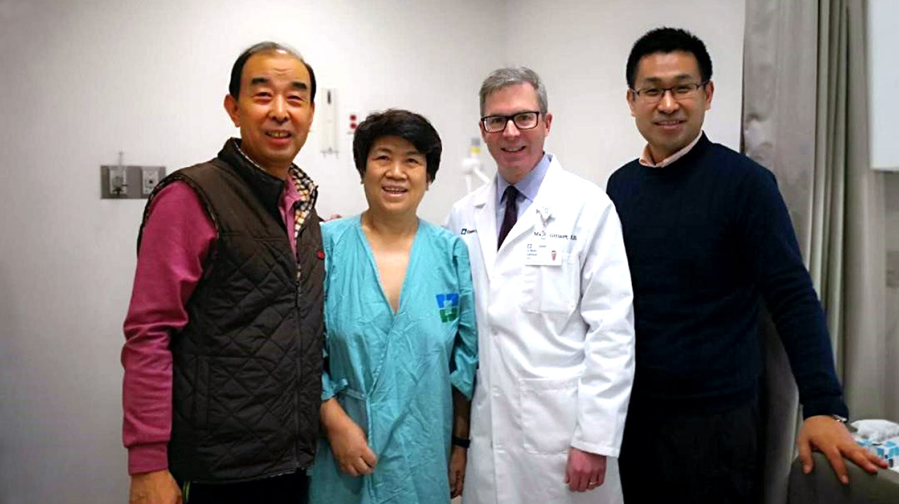 The Wu family’s research about mitral valve surgery led them to Cleveland Clinic and Dr. Marc Gillinov. Pictured, left to right: Zhigang and Yuexian Wu; Marc Gillinov, MD; Xiaoyo Wu.