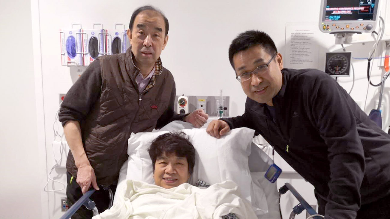Yuexian Wu (center) underwent successful minimally invasive mitral valve repair surgery in January 2019. Her husband Zhigang (left) and son Xiaoyo (right) made the trip from Shanghai to Cleveland with her.