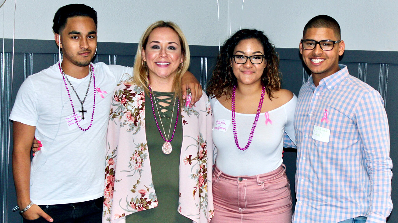 Marilyn (second from left) celebrates with her children: Marc-Anthony Alejandro, Kayla Alejandro, and Isaiah Alejandro-Rodriguez.