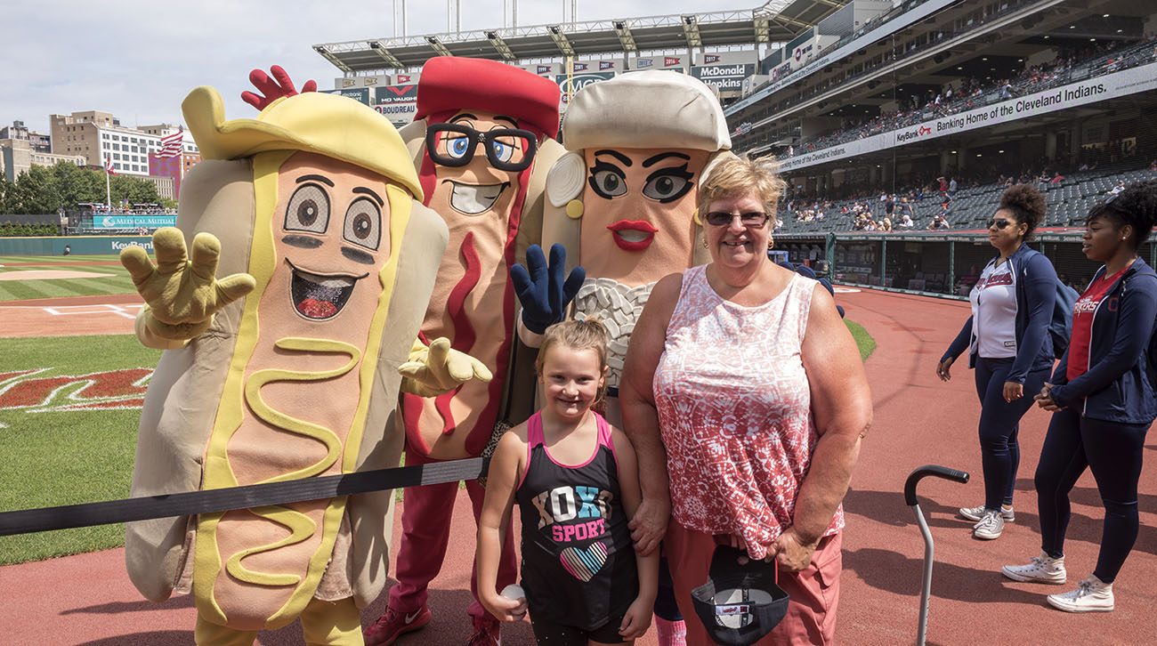 Judy threw the first pitch at the Cleveland Indians game, with her granddaughter, Peyton, by her side. (Courtesy: Cleveland Clinic)