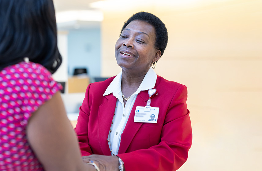 An image example of a Red Coat helping a patient.