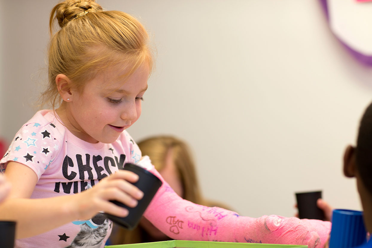 Girl Playing Game with Cast