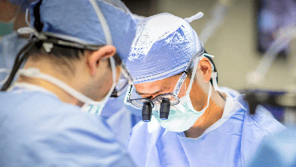 Two doctors performing surgery