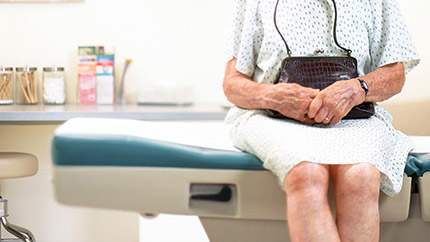Older woman sitting in a doctor's office