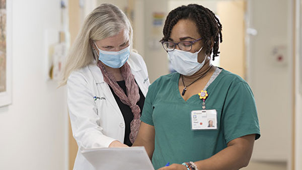 Cleveland Clinic medical staff reviewing patient paperwork together.