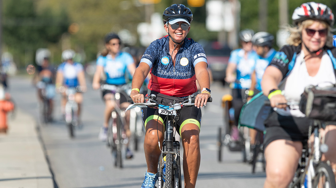 Claire riding in Bike to Cure